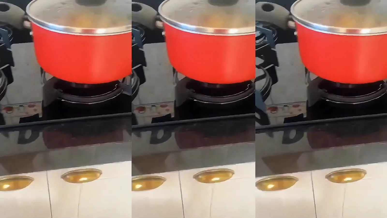 Panela posicionada sobre trempe com chama acesa no cooktop